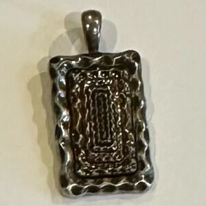 Lia Sophia pendant in silvertone with gold and black accents.  Good used cond
